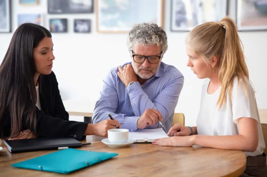 Attorney discussing a family legal matter with clients in Casas Adobes Arizona