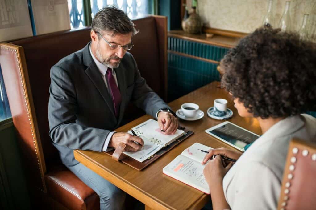 business-people-discussing-cafe_53876-20922 (1)