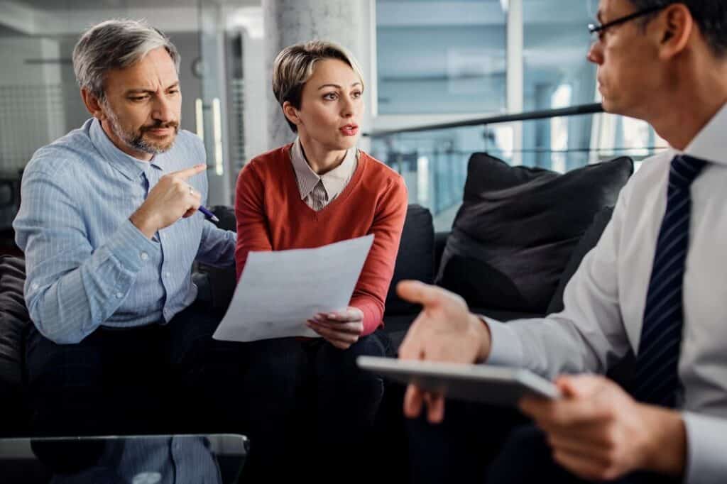 Civil litigation attorney reviewing legal documents with a client in Arizona